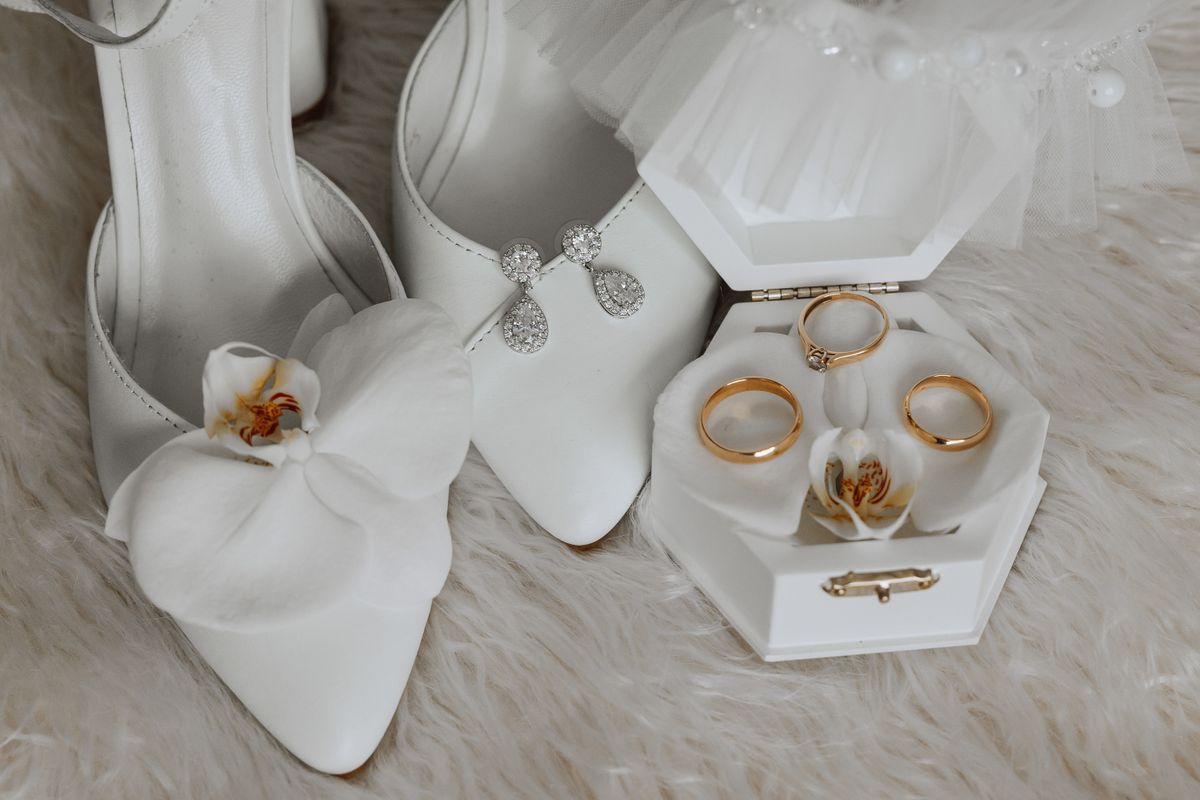 Bridal accessories including shoes, rings, and earrings